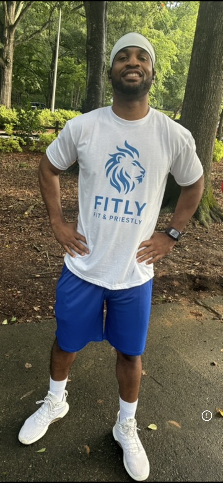 Coach Michael Miguel Wilson wearing a FITLY shirt outdoors